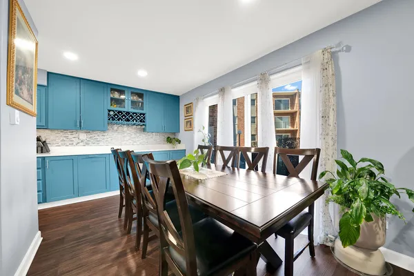 a view of a dining room with furniture and window