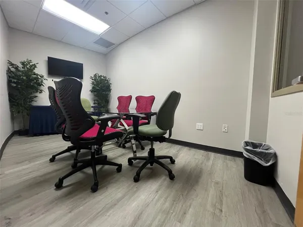 a workspace with furniture and wooden floor