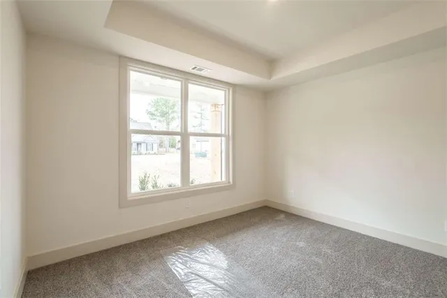 a view of an empty room and closet area