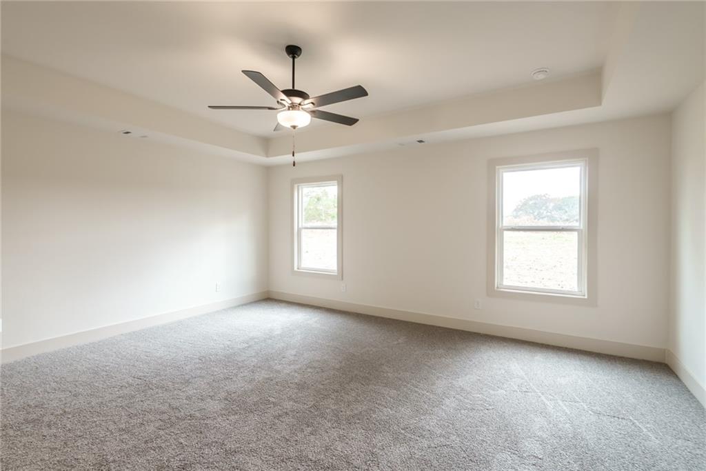 224 Good Hope Preserve Good Hope, GA 30641 - Photo 23 of 60 an empty room with a window and a fan