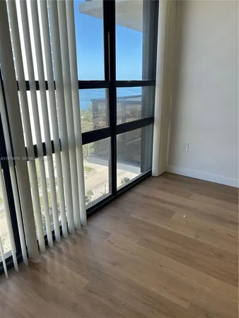 a view of front door with wooden floor