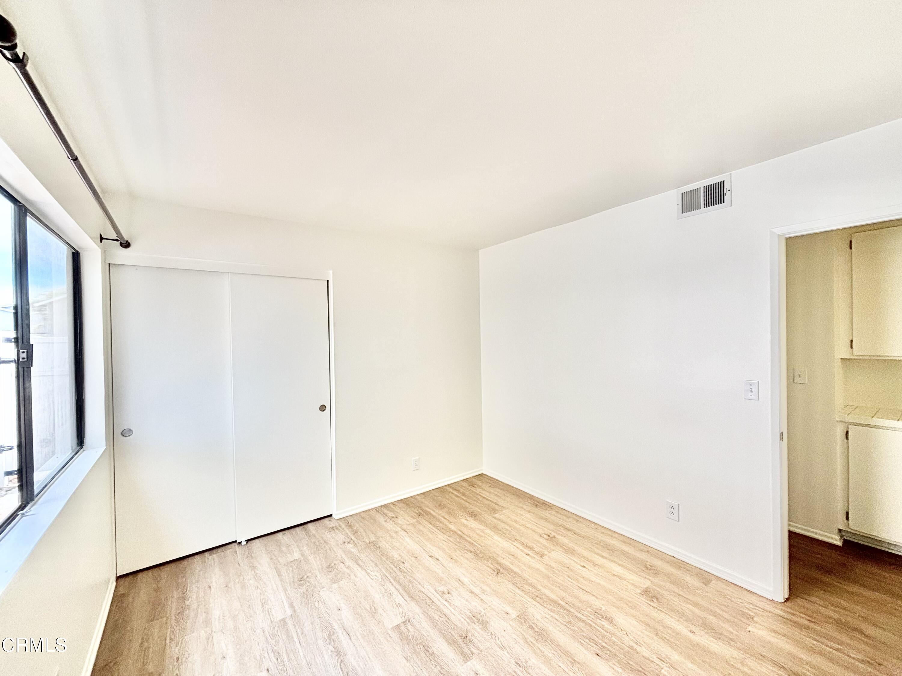 4911 Catamaran Street Oxnard, CA 93035 - Photo 14 of 38 a view of empty room with wooden floor