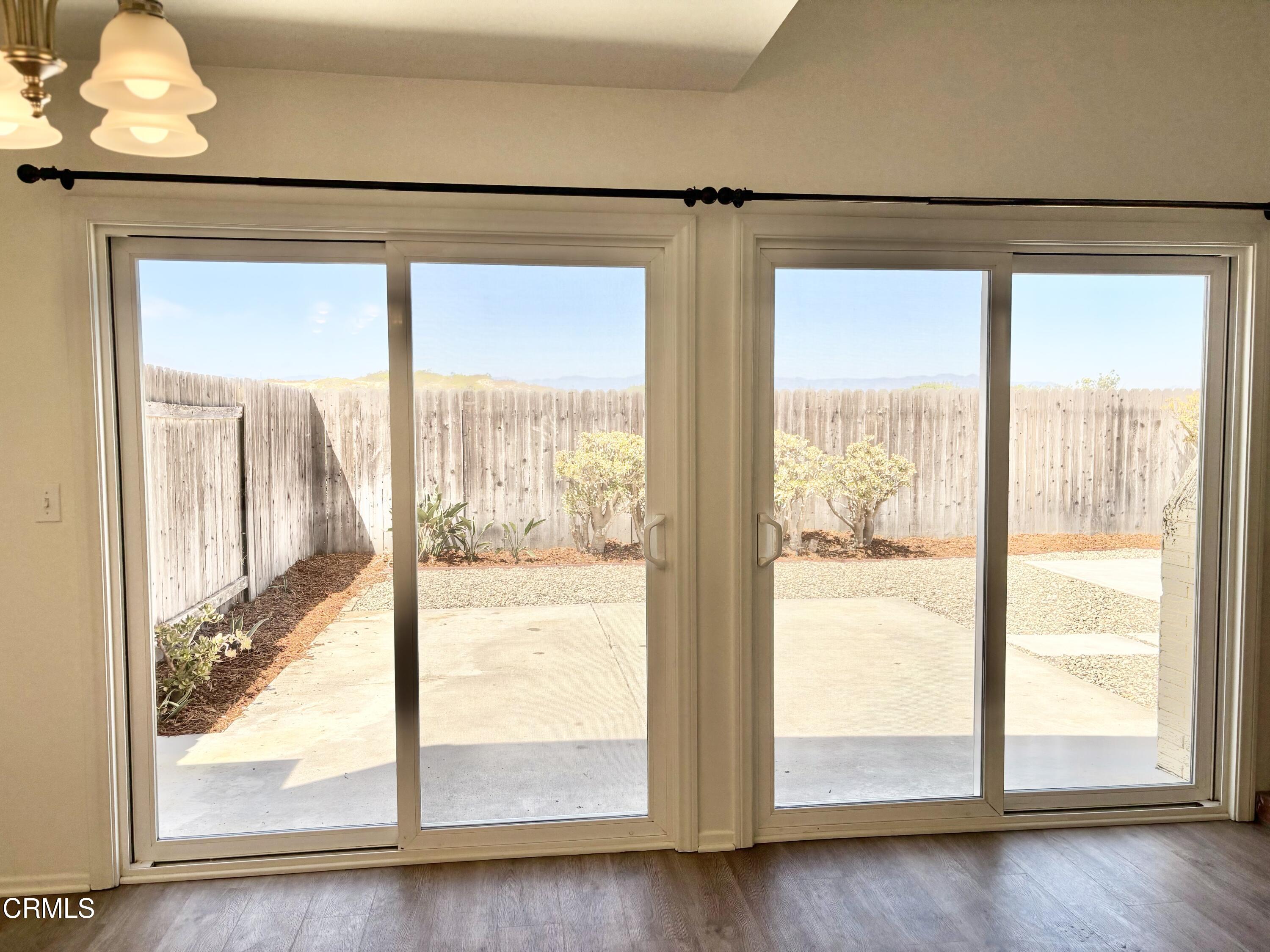 4911 Catamaran Street Oxnard, CA 93035 - Photo 18 of 38 a view of an empty room with wooden floor and a window