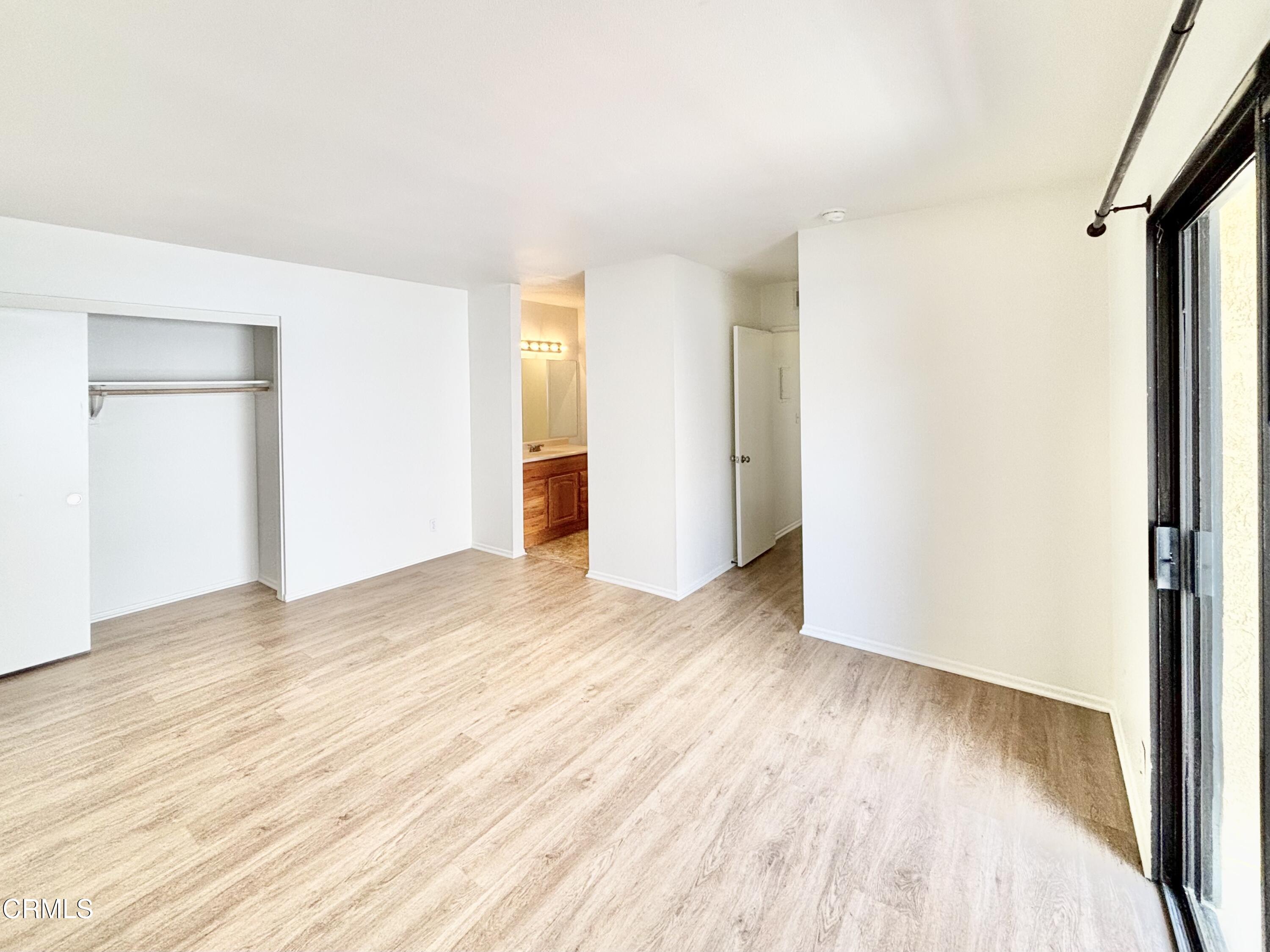 4911 Catamaran Street Oxnard, CA 93035 - Photo 22 of 38 a view of an empty room with wooden floor
