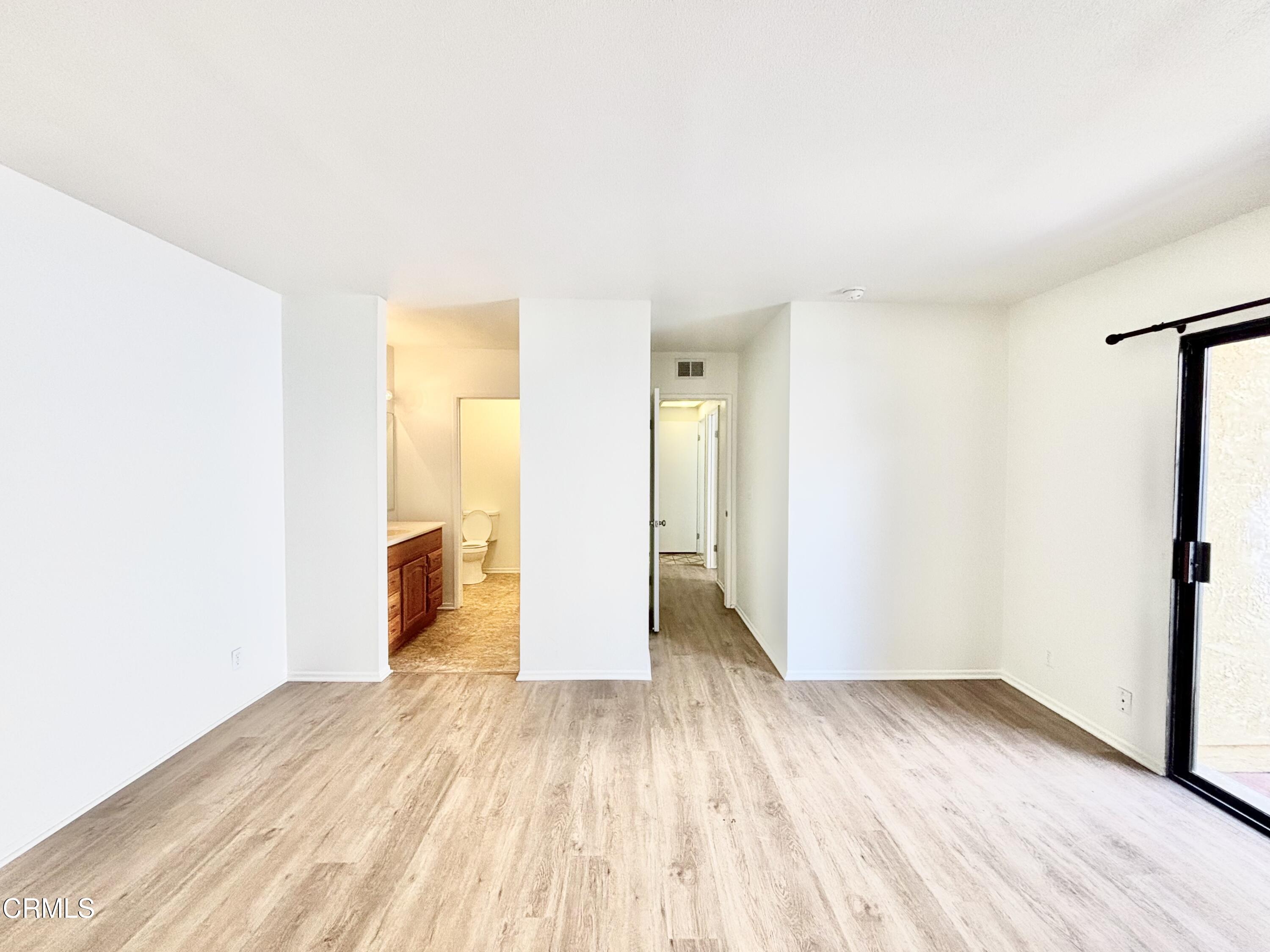 4911 Catamaran Street Oxnard, CA 93035 - Photo 23 of 38 a view of empty room with wooden floor