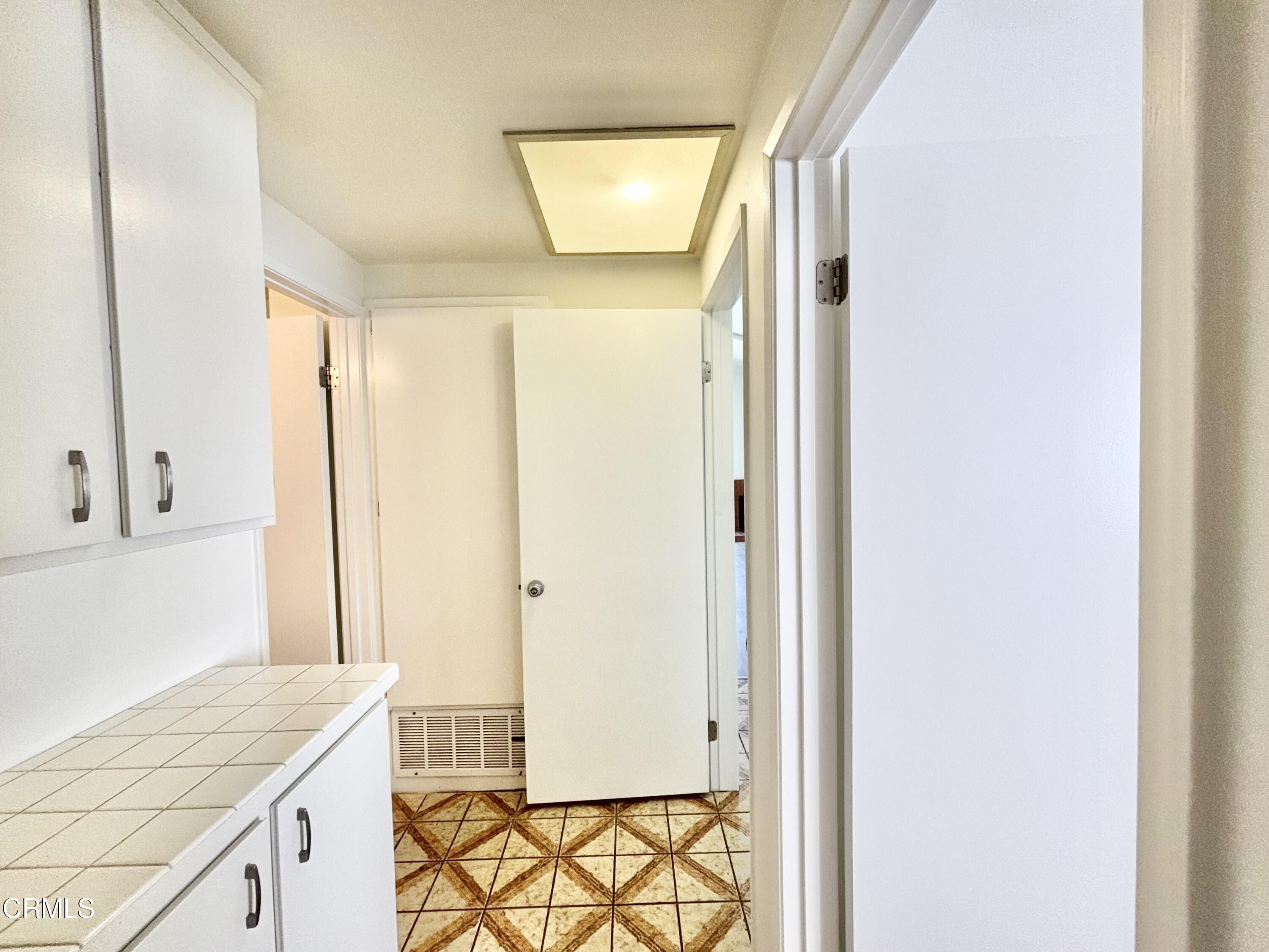 4911 Catamaran Street Oxnard, CA 93035 - Photo 30 of 38 a bathroom with a granite countertop sink and a mirror