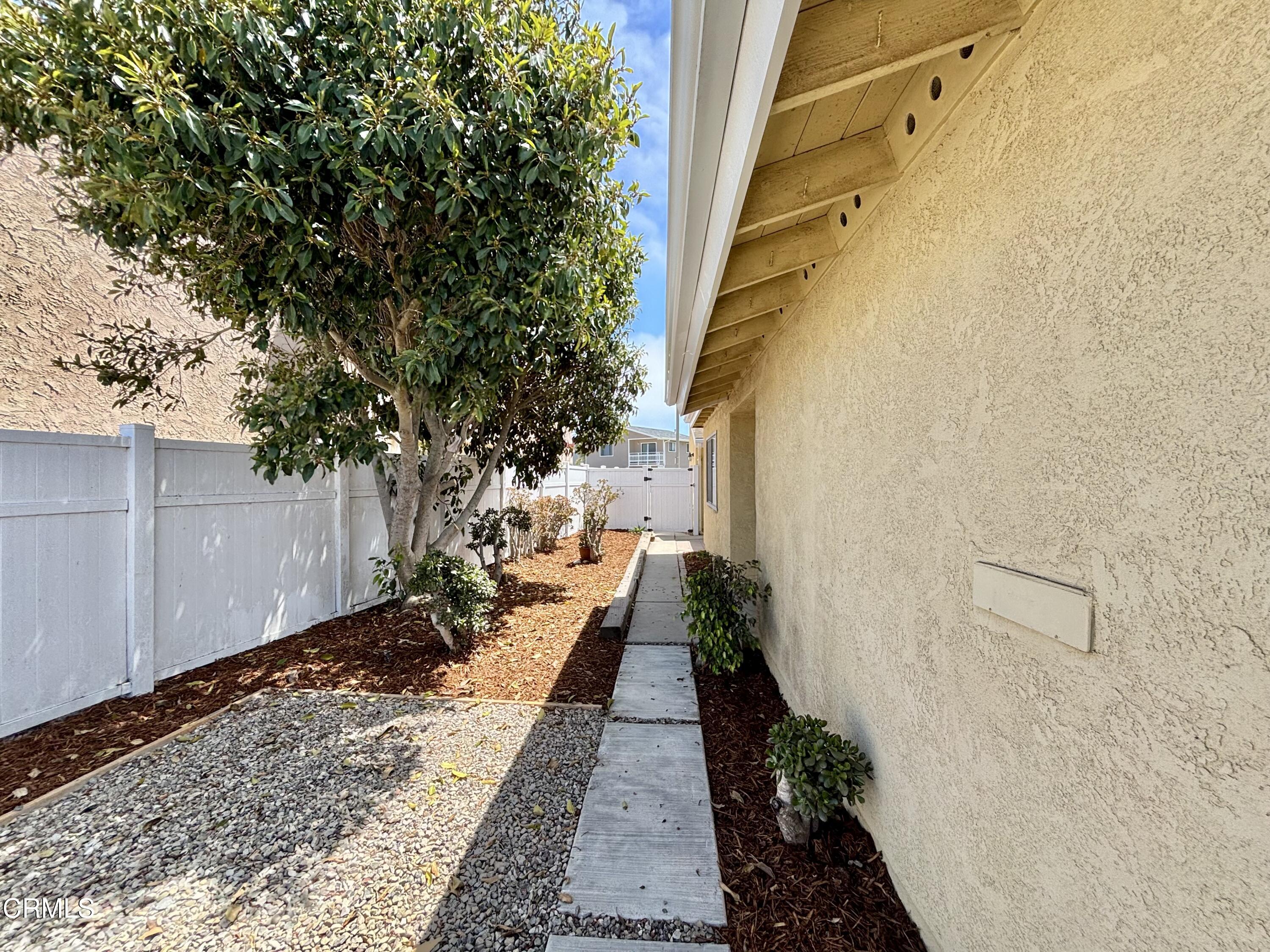 4911 Catamaran Street Oxnard, CA 93035 - Photo 34 of 38 a view of a backyard with pathway