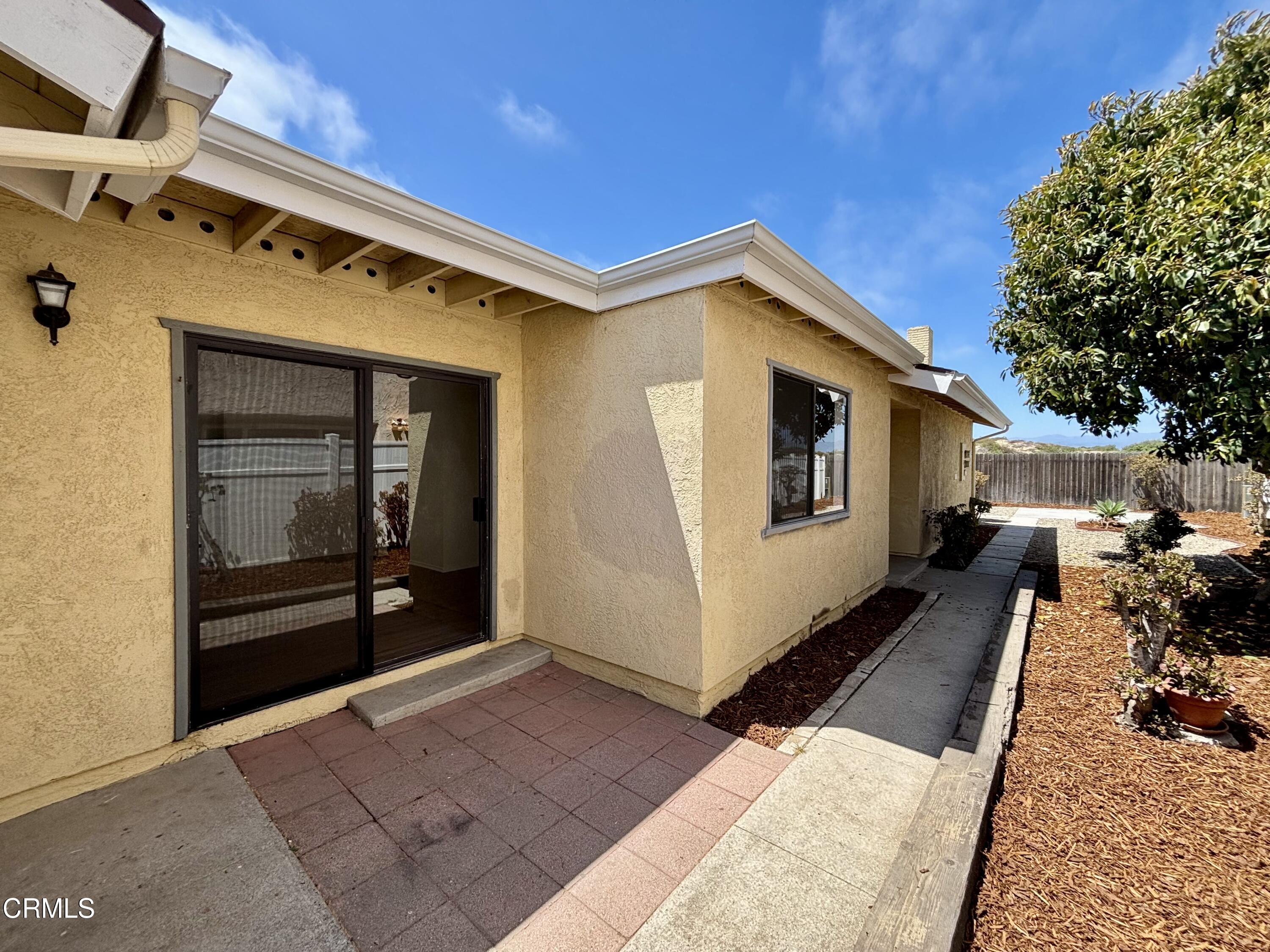 4911 Catamaran Street Oxnard, CA 93035 - Photo 37 of 38 a front view of a house with yard