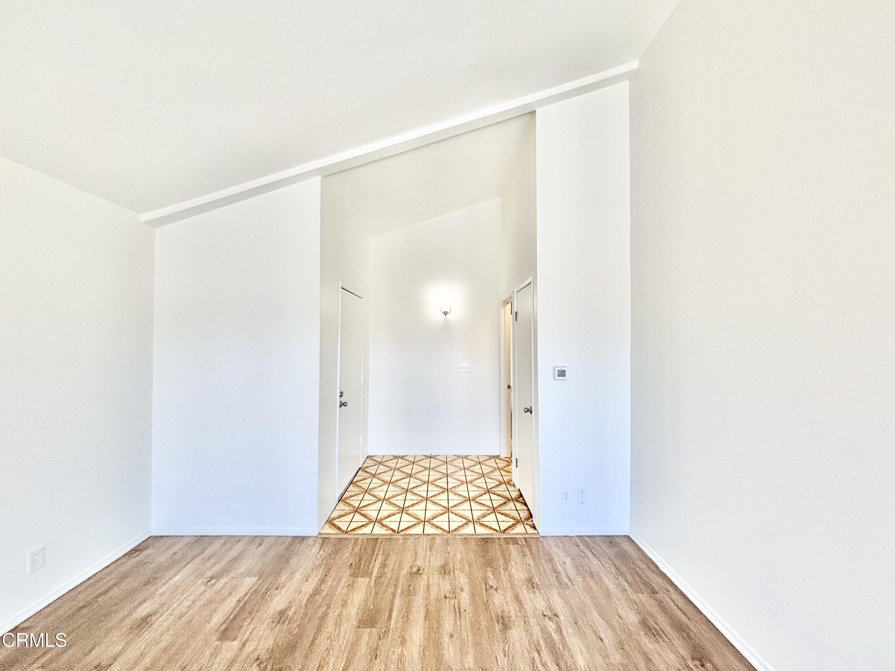 4911 Catamaran Street Oxnard, CA 93035 - Photo 8 of 38 a view of a room with wooden floor