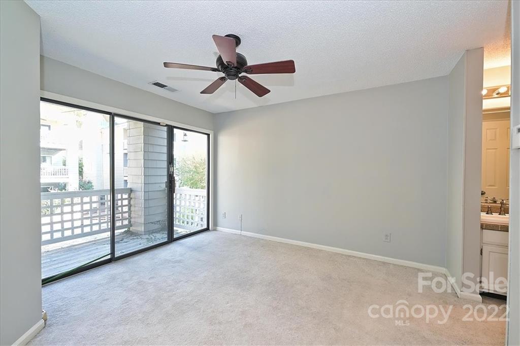 222 Queens Road, Unit 56 Charlotte, NC 28204 - Photo 13 of 23 a view of an empty room with a window