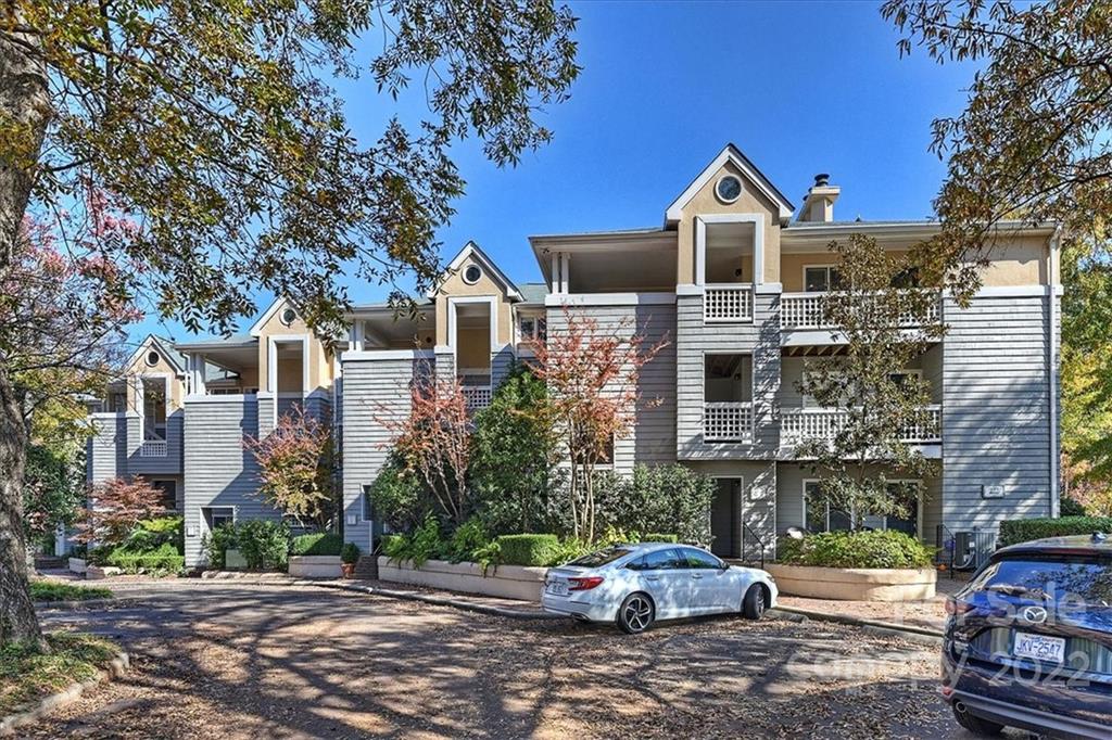 222 Queens Road, Unit 56 Charlotte, NC 28204 - Photo 2 of 23 a front view of a house with a garden