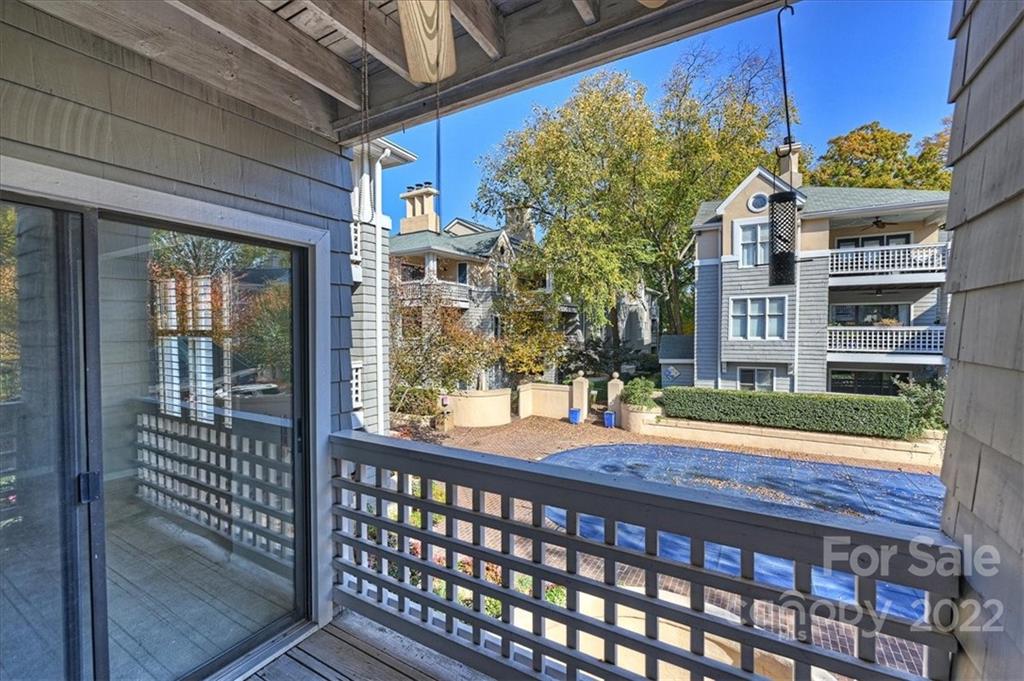 222 Queens Road, Unit 56 Charlotte, NC 28204 - Photo 22 of 23 a view of a brick house with a porch