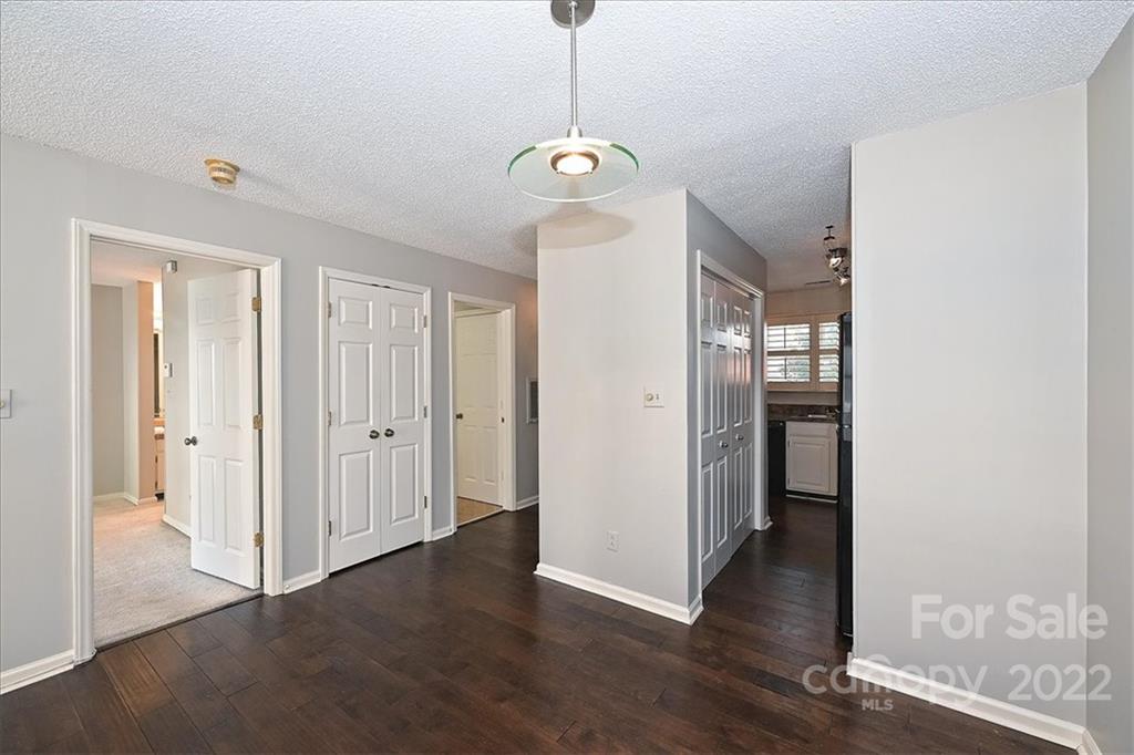 222 Queens Road, Unit 56 Charlotte, NC 28204 - Photo 9 of 23 a view of a hallway with wooden floor