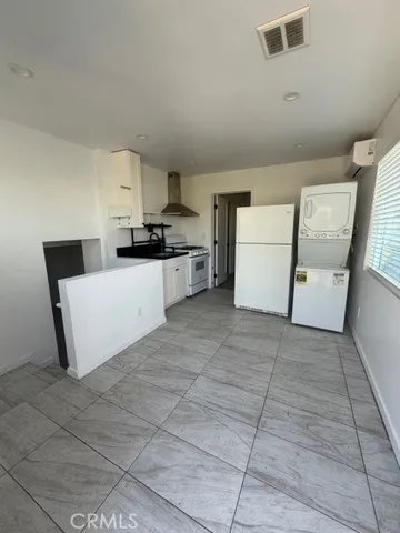 an empty room with wooden floor and closet