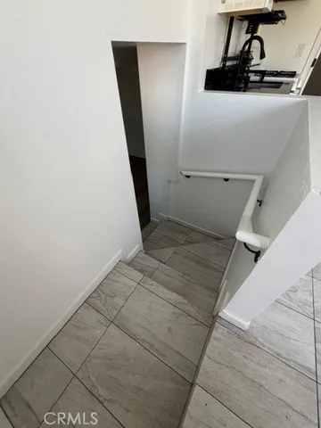 a white stove top oven sitting inside of a kitchen