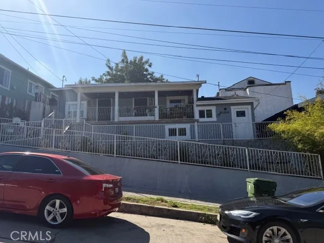 a view of a car parked in back of a house