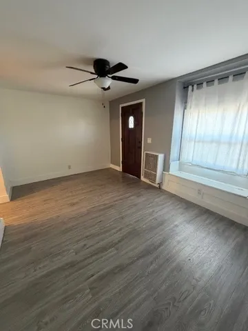 a kitchen with a stove a refrigerator and a cabinets
