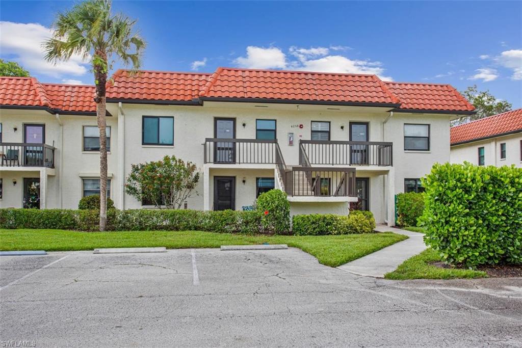 4258 27th Court Southwest, Unit 106 Naples, FL 34116 - Photo 1 of 19 first floor end unit