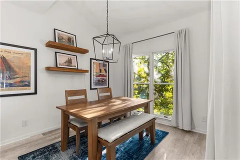 a view of a livingroom with furniture window and wooden floor