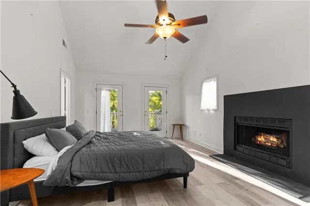 a bed room with a bed and a fireplace