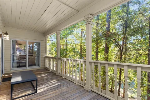 a view of a two chairs in the balcony
