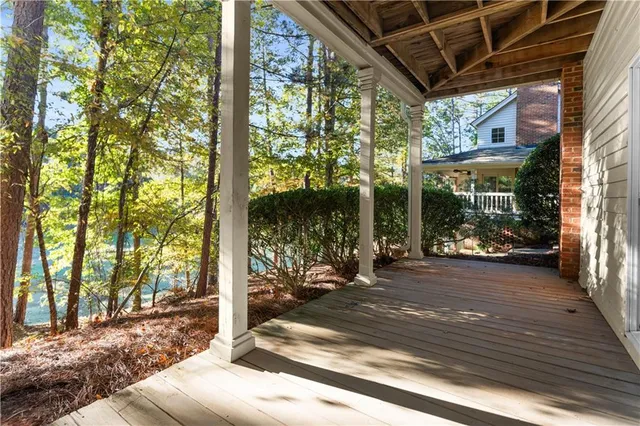 a view of a room with wooden floor and iron stairs