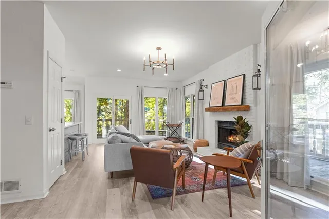 a view of a livingroom with furniture window and wooden floor