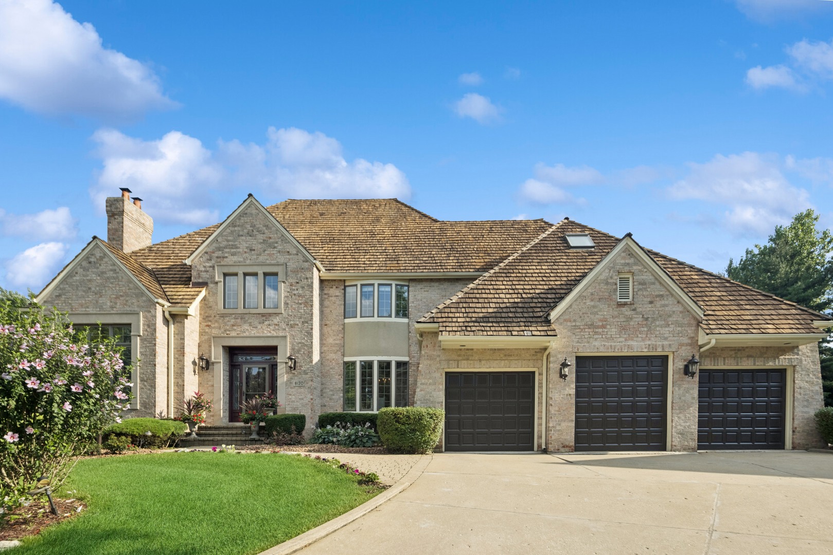 front view of a house with a yard