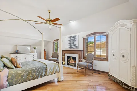 a bed room with a bed and a fireplace