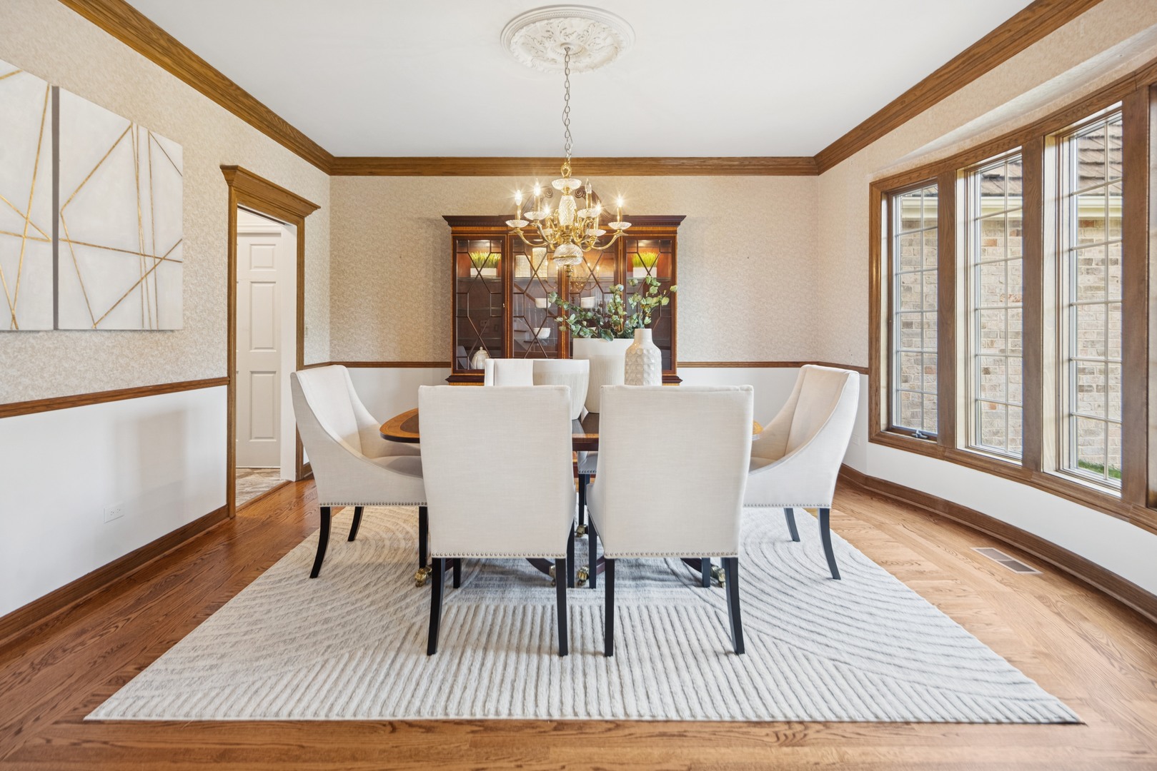 8120 Woodside Lane Burr Ridge, IL 60527 - Photo 4 of 24 a view of a dining room with furniture window and wooden floor