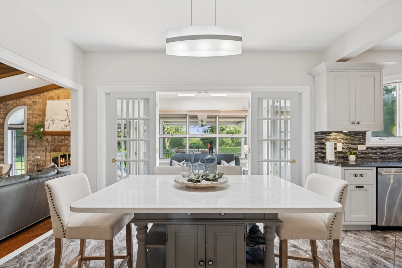 8120 Woodside Lane Burr Ridge, IL 60527 - Photo 7 of 24 a dining room with furniture a chandelier and wooden floor