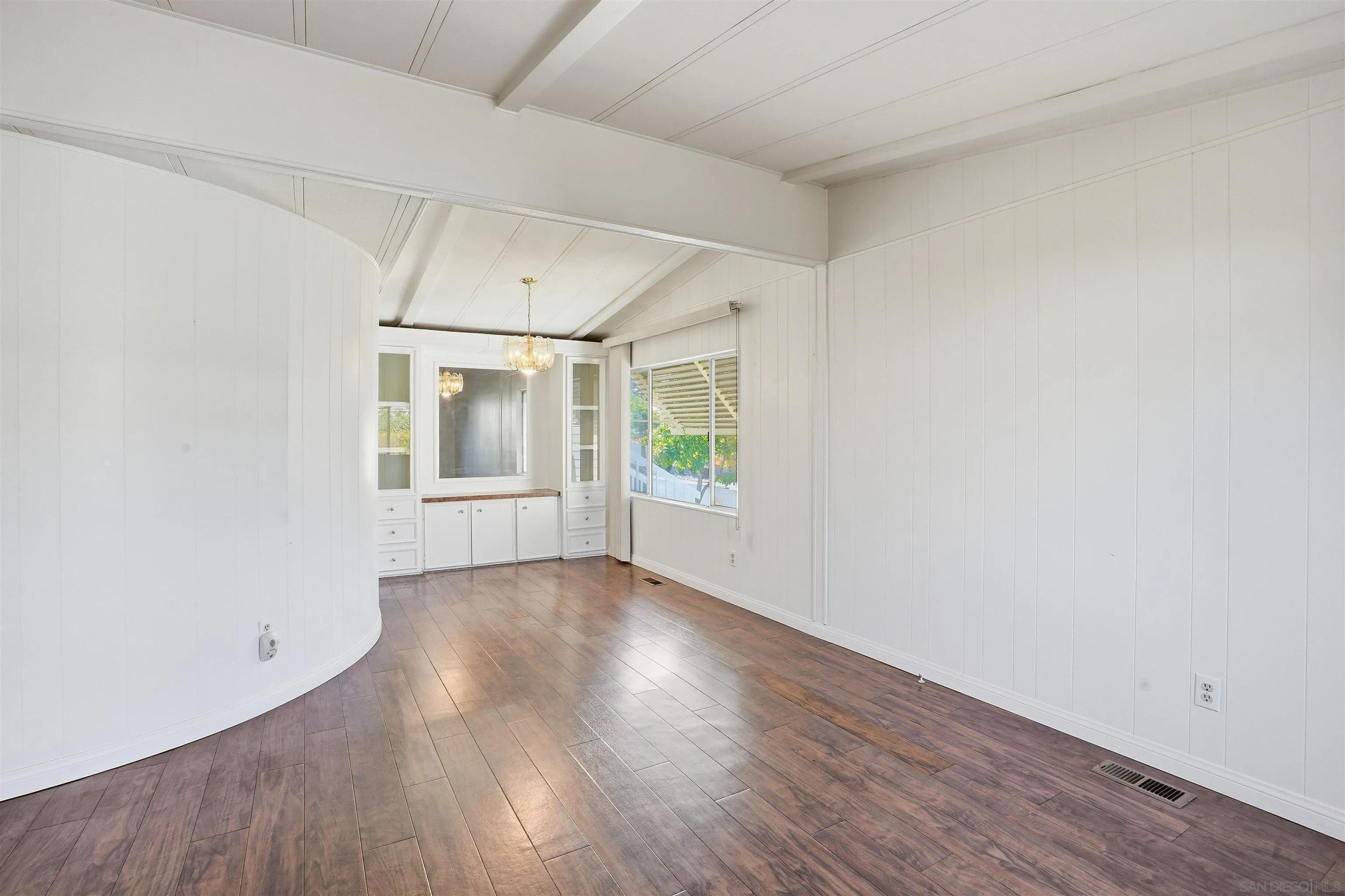 9255 North Magnolia Avenue, Unit 339 Santee, CA 92071 - Photo 15 of 55 an empty room with wooden floor and windows
