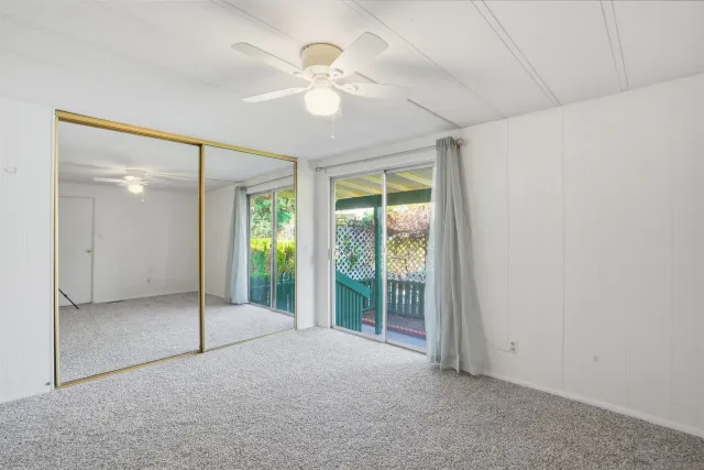 en empty room with windows and city view