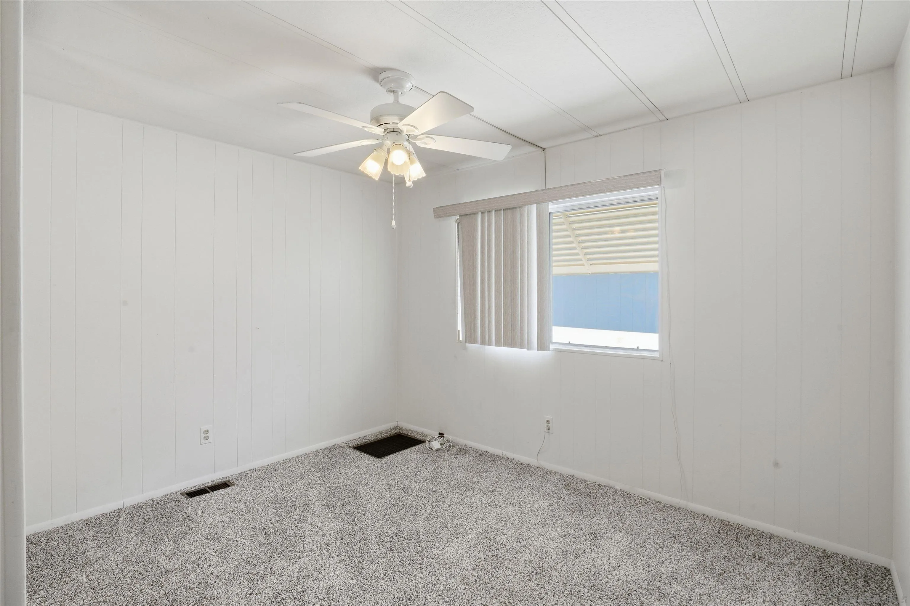 9255 North Magnolia Avenue, Unit 339 Santee, CA 92071 - Photo 22 of 55 an empty room with windows and fan