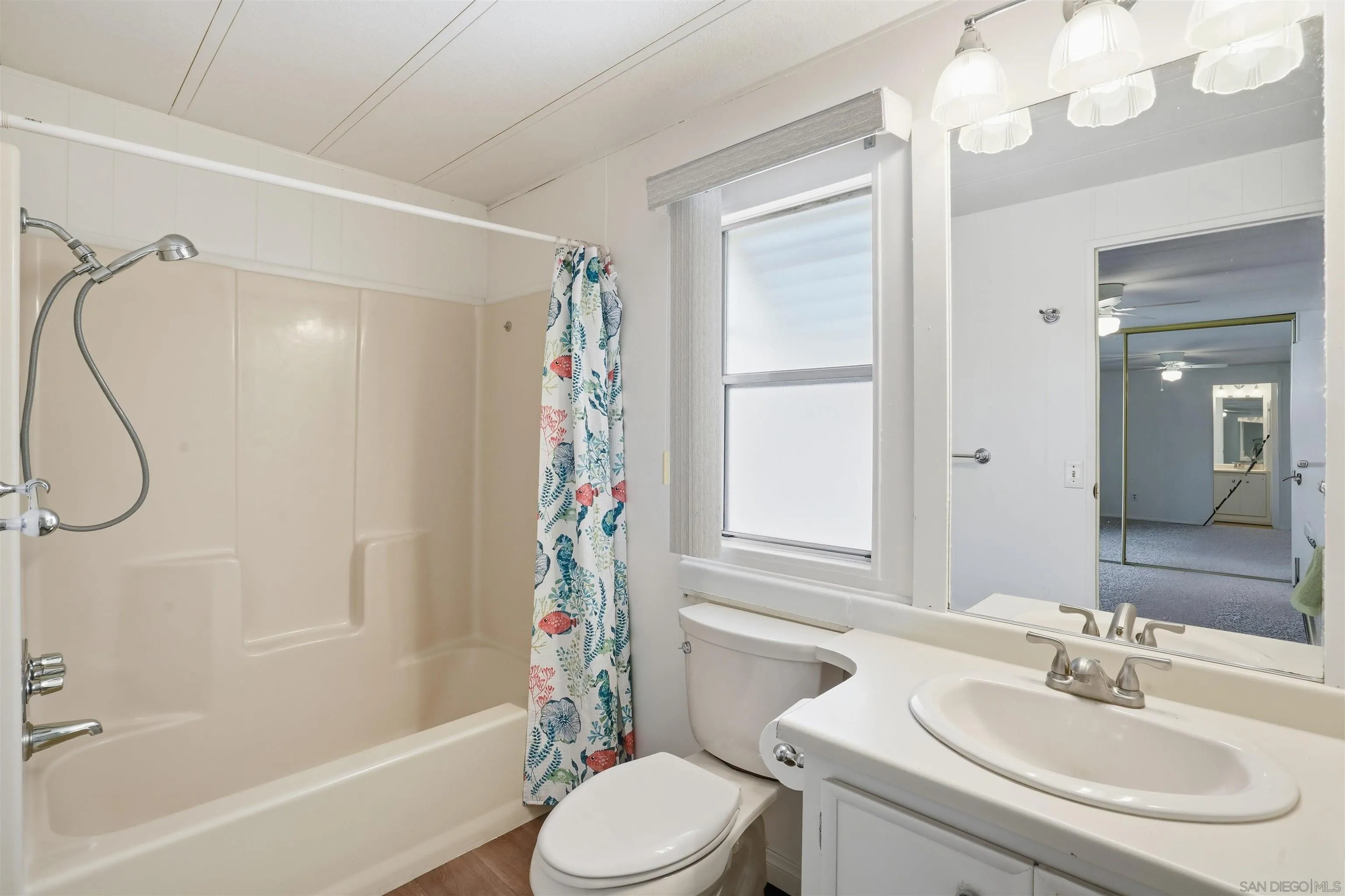 9255 North Magnolia Avenue, Unit 339 Santee, CA 92071 - Photo 24 of 55 a bathroom with a sink toilet and shower