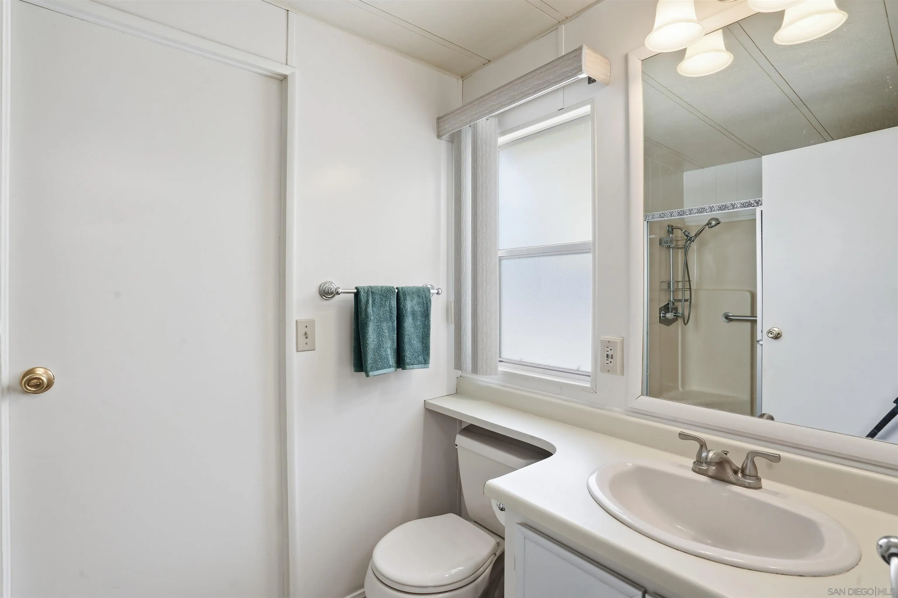 9255 North Magnolia Avenue, Unit 339 Santee, CA 92071 - Photo 28 of 55 a bathroom with a sink toilet and shower