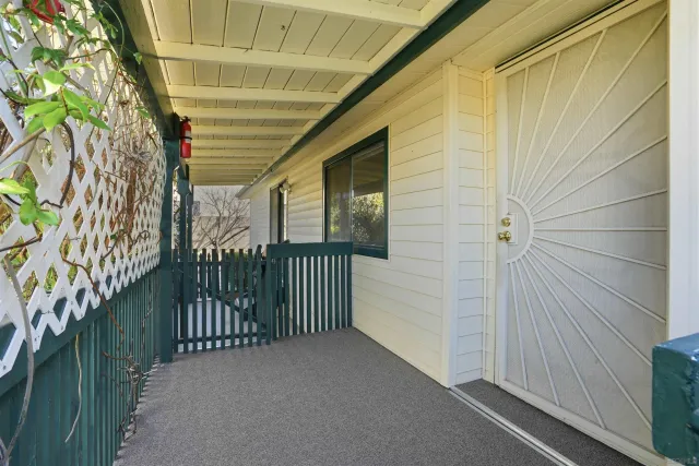 a view of a pathway of a house with plants