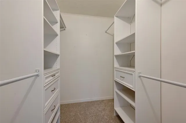 a view of an empty walk in closet