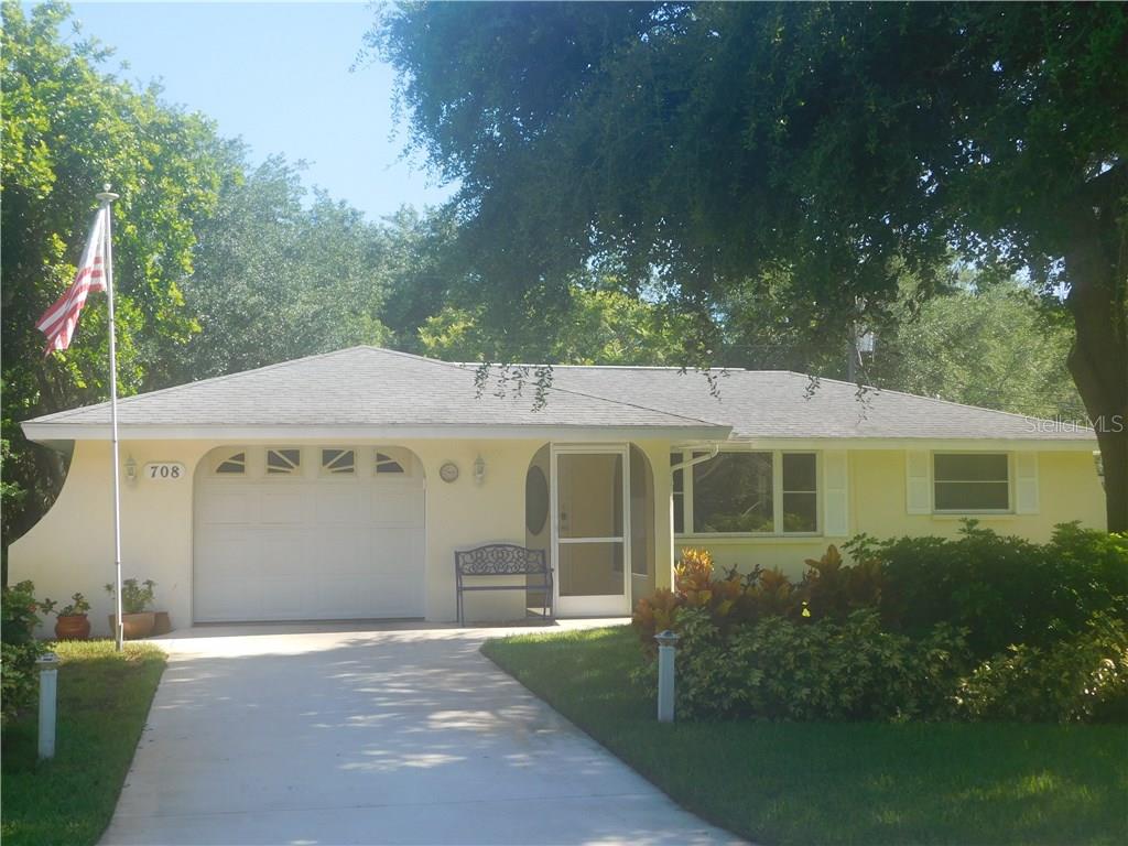 708 Cypress Road Venice, FL 34293 - Photo 1 of 1 a front view of a house with garden