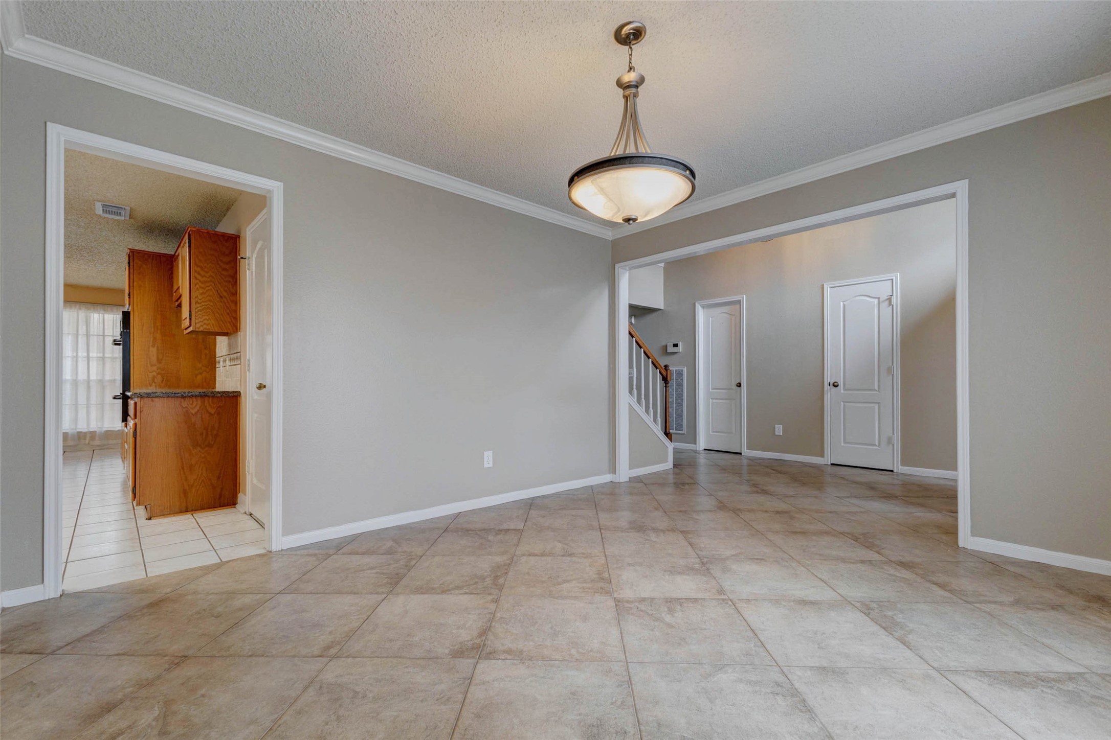 3107 Dulaney Road Houston, TX 77084 - Photo 7 of 50 a view of a room with a chandelier fan and windows