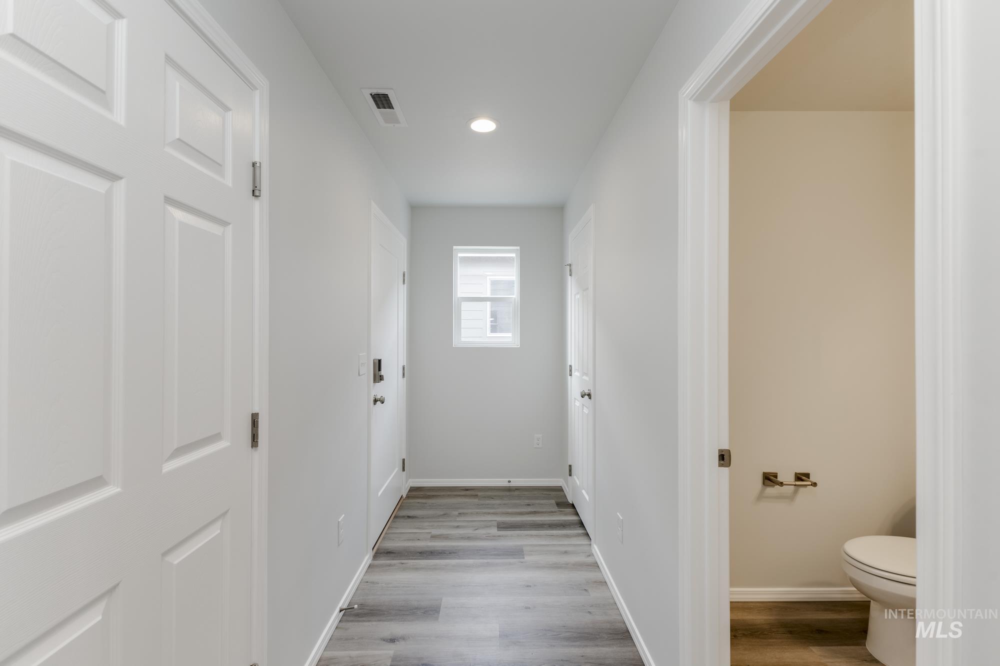 10833 Rutland Street Caldwell, ID 83605 - Photo 2 of 26 Hallway with light wood-style floors and recessed lighting