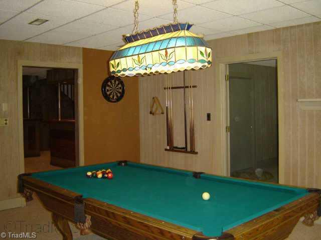 8000 Eastridge Road Oak Ridge, NC 27310 - Photo 2 of 8 Other. Great billard room! The door to the right leads to the 4th bedroom/office/playroom. The door to the left leads to the family room and stair case to the main level.