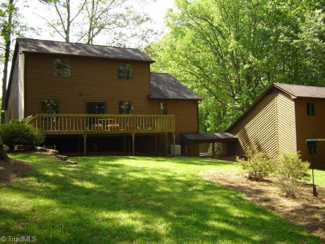 8000 Eastridge Road Oak Ridge, NC 27310 - Photo 4 of 8 Other. Rear view of this beauty. Nothing left to do except move in. This landscaped peaceful retreat is waiting for...YOU!!