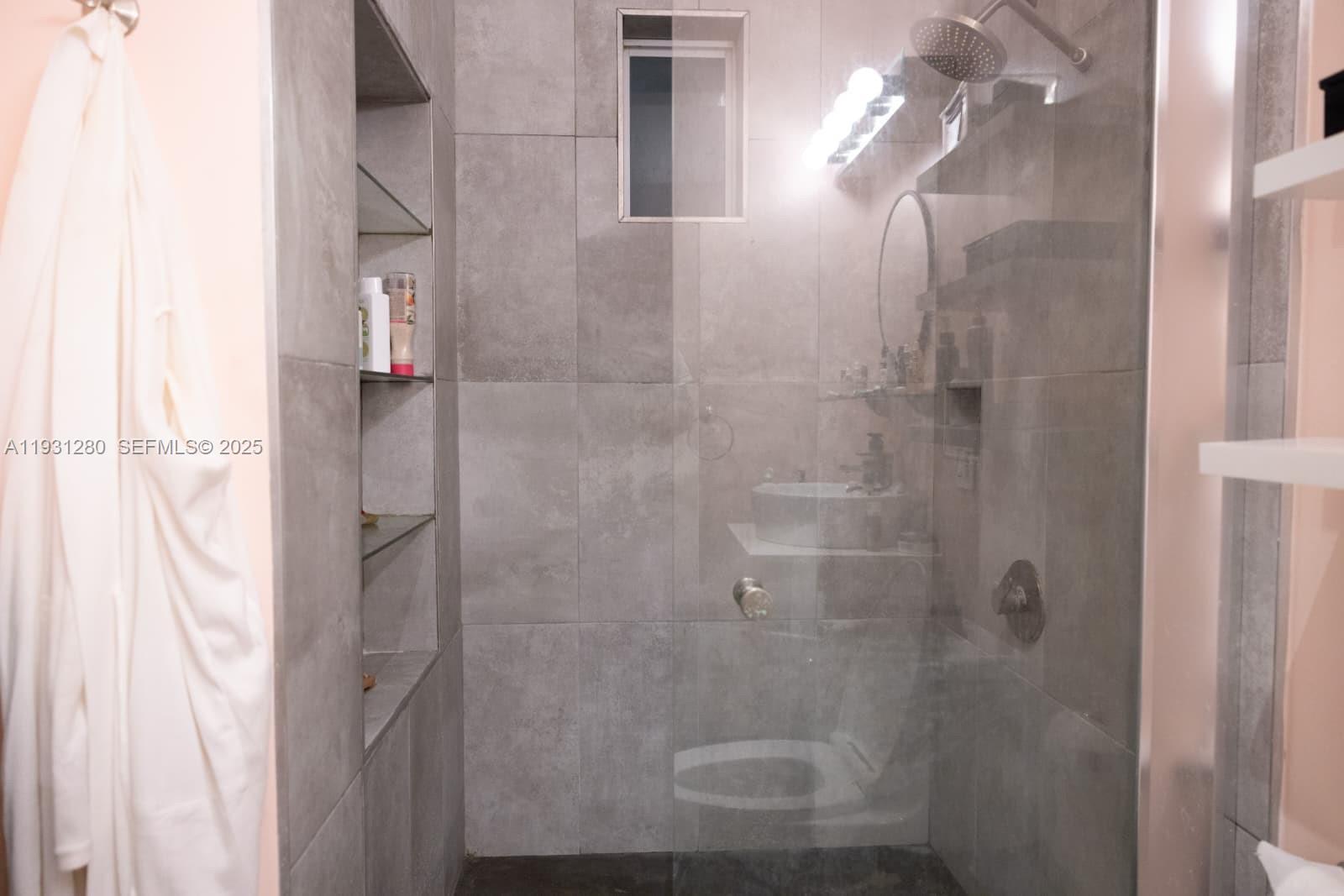 6260 Southwest 24th Street, Unit B Miami, FL 33155 - Photo 11 of 13 a bathroom with a shower