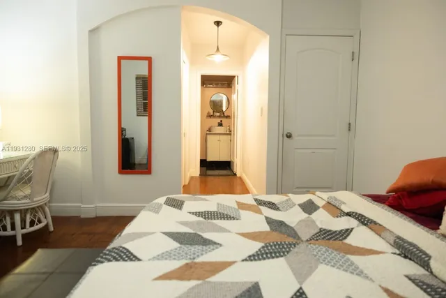 a bedroom with a bed and a chair