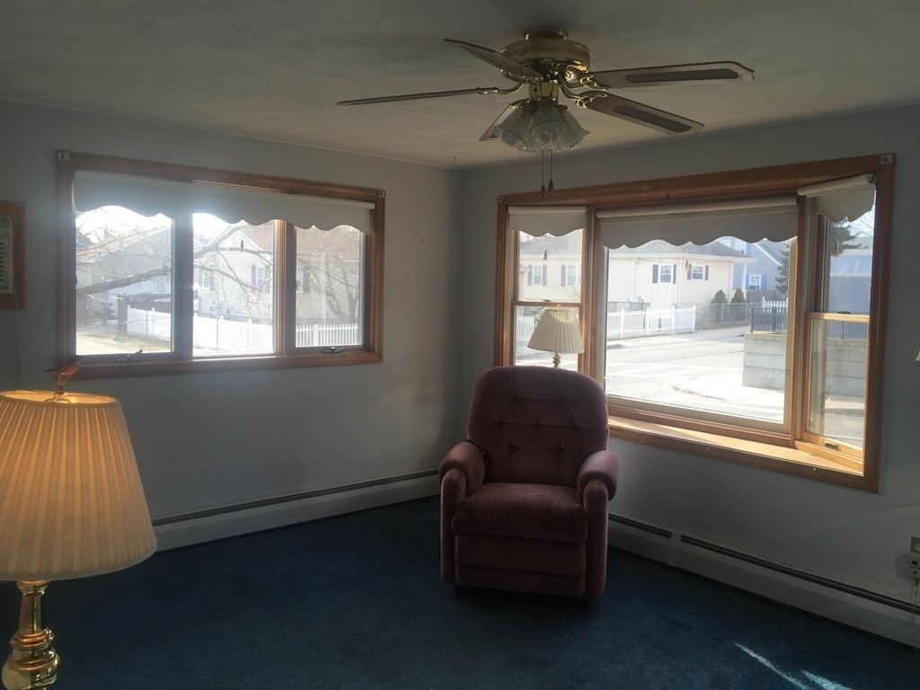254 Jackson Street Fall River, MA 02721 - Photo 5 of 15 a living room with furniture and a window