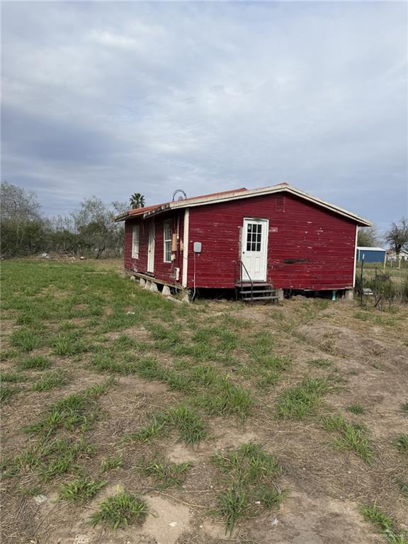 29115 Couch Avenue Hargill, TX 78549 - Photo 3 of 13 a view of front of a house with a yard