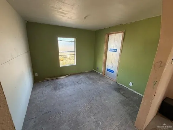 a view of room with window and bathroom