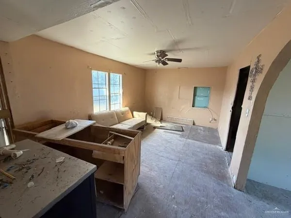 a living room with furniture and a window