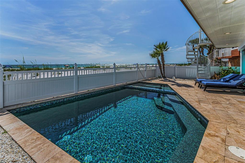 13303 Gulf Lane Madeira Beach, FL 33708 - Photo 3 of 42 a view of swimming pool from a balcony